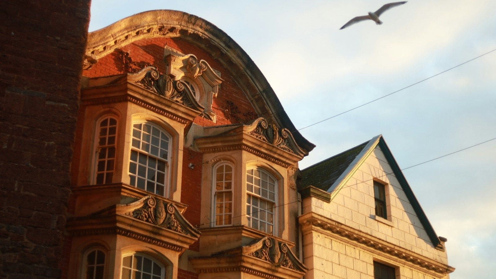Historic buildings in Exeter city centre at dusk